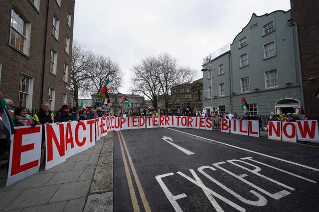 Protesters gathered outside Leinster House in Dublin ahead of the first sitting of the new Dail since the general election