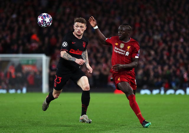 Atletico Madrid's Kieran Trippier, left, in action during the Champions League clash with Liverpool