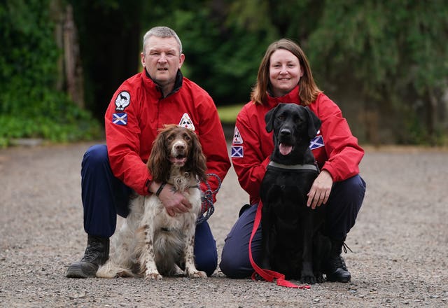 John Miskelly with his dog Bracken alongside team member Emma Dryburgh and her dog Dougal at his home in Falkland, Fife