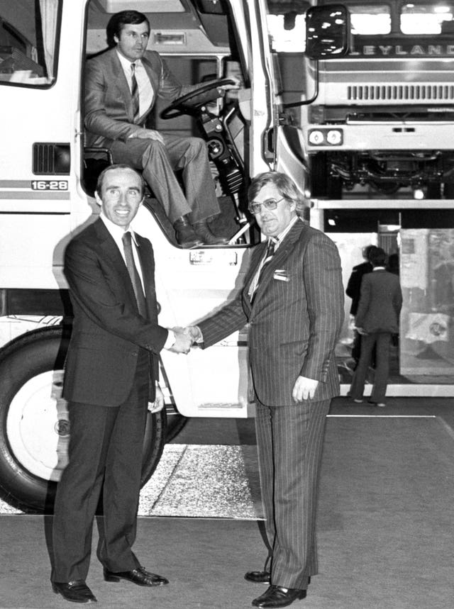 Frank Williams (left), owner of the F1 World Championship-winning team shakes hands with Frank Andrew, of sponsors Leyland Vehicles