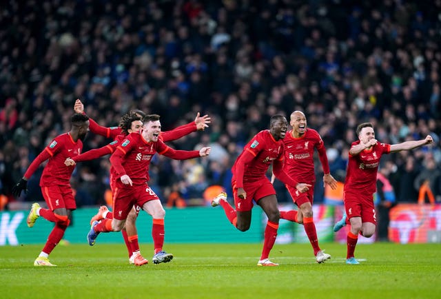 Liverpool players celebrate winning the shootout