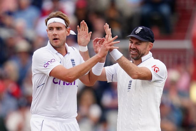 Stuart Broad, left, and Jimmy Anderson celebrate while in action for England