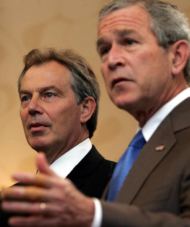 Tony Blair standing alongside President George Bush