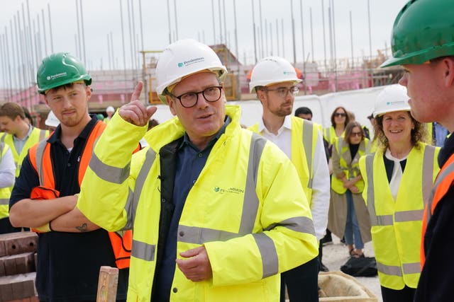 Labour leader Sir Keir Starmer in a hard hat and hi-vis jacket during a visit to see homes being constructed in York