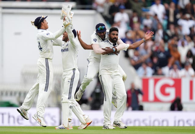 Mohammed Siraj, right, and India celebrate after taking the match-winning wicket of England's Gus Atkinson, not pictured