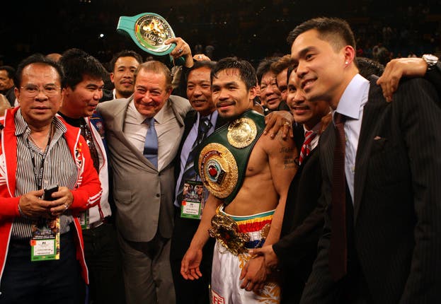 Pacquiao, centre right, produced arguably his finest performance to beat Miguel Cotto (Dave Thompson/PA)