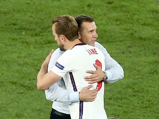 Ukraine coach Andriy Shevchenko hugs Harry Kane after the game