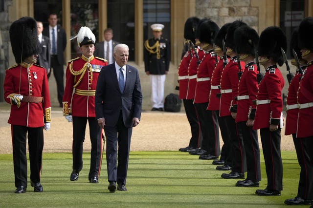 US President Joe Biden inspects a Guard of Honour during a visit to Windsor Castle