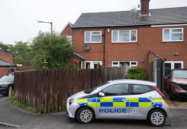 A police car outside a house