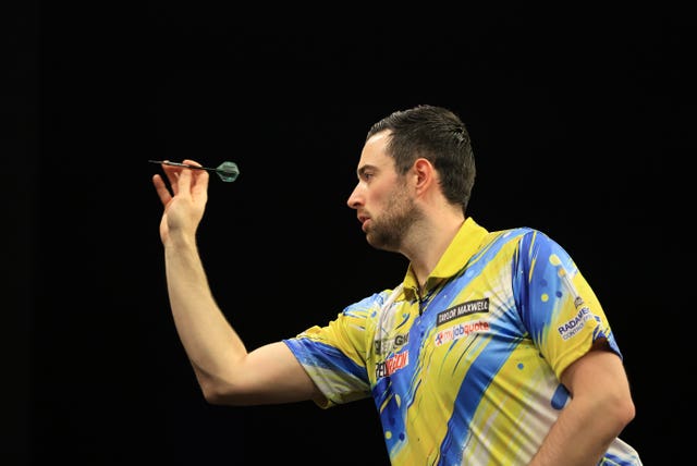 Luke Humphries during a darts match