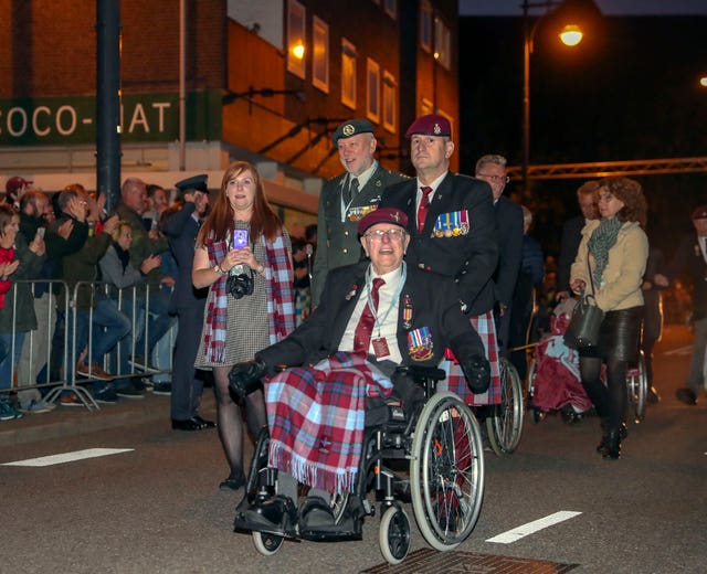 Former paratrooper Sandy Cortmann, front, from Aberdeen, joins the march to The Bridge to Liberation Experience held on the John Frost Bridge in Arnhem, the Netherlands