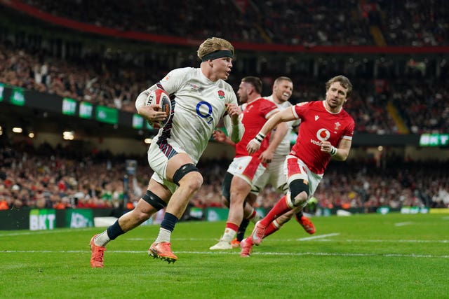 Henry Henry Pollock runs in to score a try for England against Wales