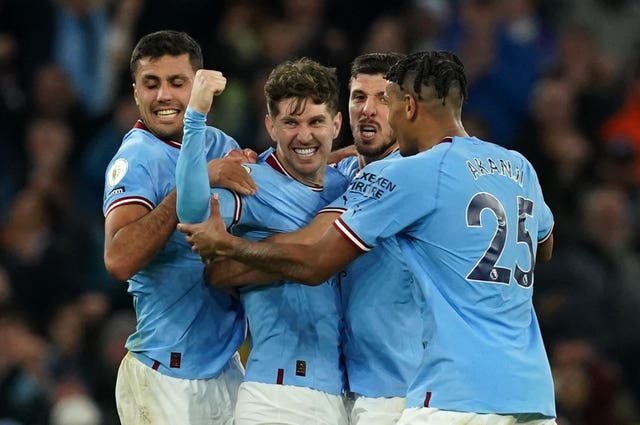 John Stones celebrates scoring against Arsenal