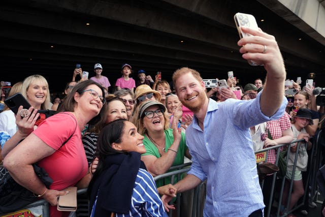 The Duke and Duchess of Sussex pose for a selfie at the Sydney Opera House, in April (