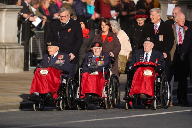 World War II veterans (left to right) Mervyn Kersh, Jim Grant centre, Henry Rice on Whitehall ahead of the Remembrance Sunday service at the Cenotaph in London