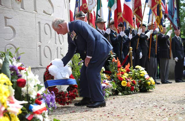 Charles lays a wreath during VE Day commemorations (Andrew Matthews/PA) 