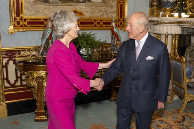 Irish President Catherine Connolly shaking hands with the King 