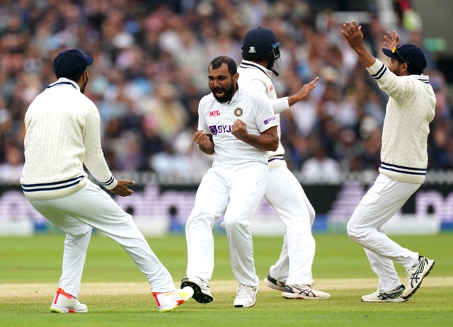 Mohammed Shami (second left) celebrates dismissing Dom Sibley 