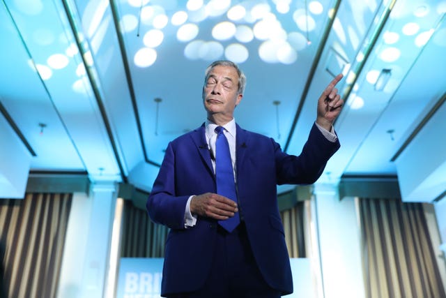 Reform UK leader Nigel Farage points to the audience as he speaks at an event at the Imperial Hotel in Blackpool