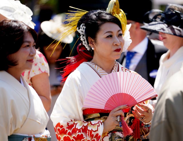 Racegoers arrive ahead of racing on day two of Royal Ascot at Ascot Racecourse