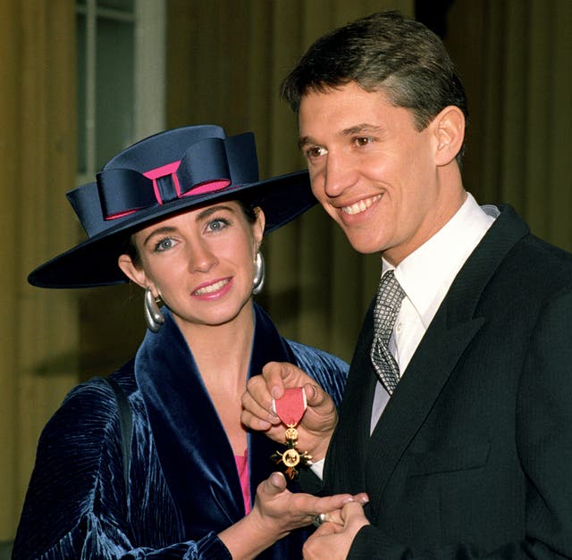 Gary Lineker with his wife Michelle holding his OBE medal