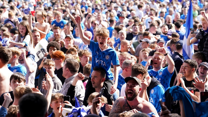 Stockport fans celebrate reaching the play-off final (Martin Rickett/PA)
