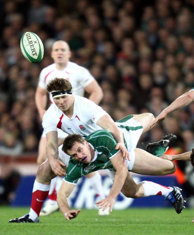 Hartley tackling Ireland's Tommy Bowe during a 2009 Six Nations match at Croke Park