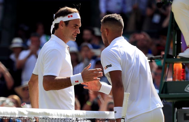 Jay Clarke, right, played Roger Federer at Wimbledon in 2019 