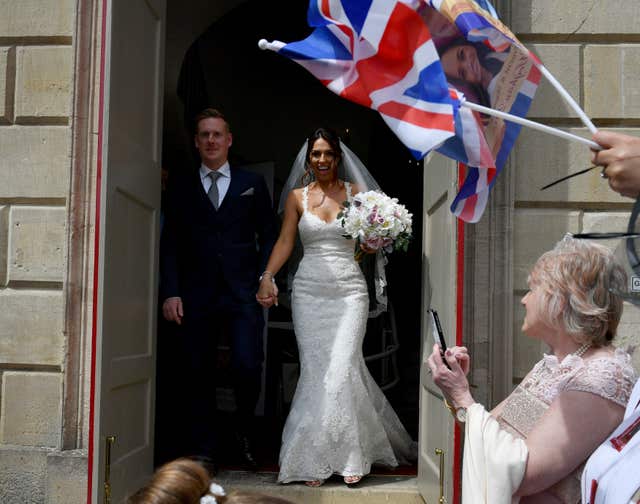 The happy couple outside Windsor Guildhall following their wedding (Ben Birchall/PA)