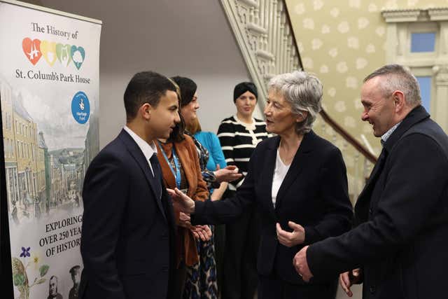 President of Ireland Catherine Connolly speaking to Abdullah Elnaem from North West Islamic Association alongside Dominic Bonner, co-ordinator of North West Youth Services, at St Columb’s Park House Peace and Reconciliation Centre in Londonderry 