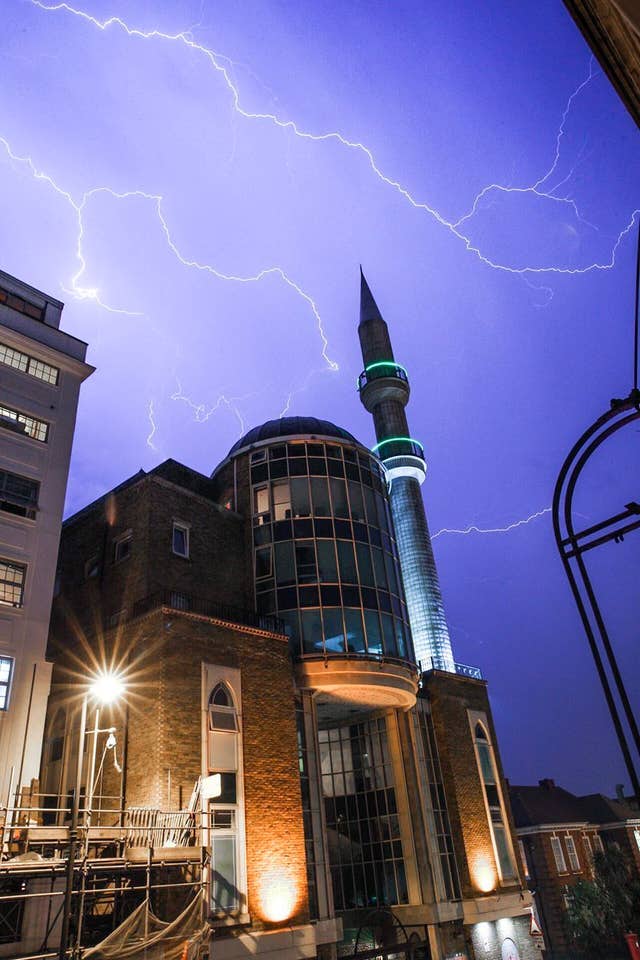 Here the sky is lit up over the Suleymaniye Mosque in Dalston, east London  (Andrew Lanxon Hoyle/@Batteryhq/PA)