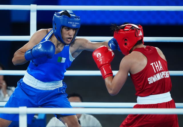 Imane Khelif, left, lands a jab on Thailand's Janjaem Suwannapheng during her Olympic semi-final