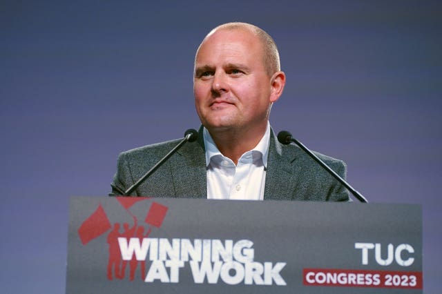 TUC general secretary Paul Nowak delivers a speech at the 2023 TUC Congress from a lectern bearing the slogan "Winning At Work"