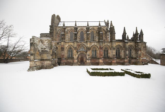Rosslyn Chapel surrounded by snow