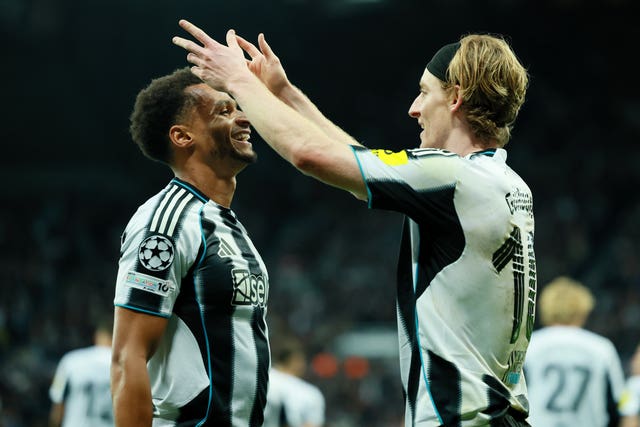 Anthony Gordon (right) celebrates scoring the opening goal in Tuesday night's 3-0 Champions League win over Benfica with creator Jacob Murphy