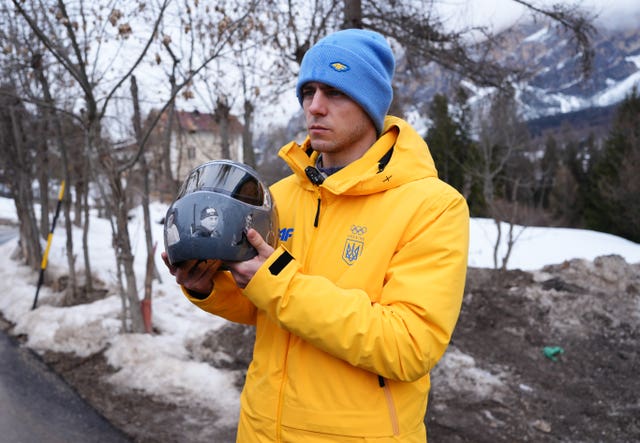 Heraskevych displays his helmet