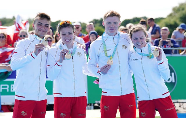 Alex Yee, Sophie Coldwell, Sam Dickinson and Georgia Taylor-Brown, l-r, collect their triathlon relay gold medals