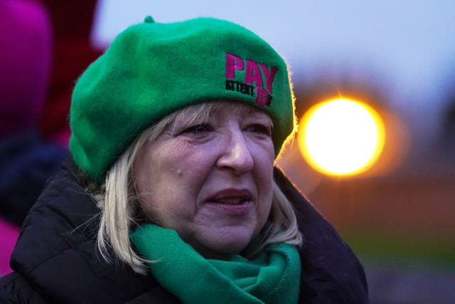 Andrea Bradley in a green EIS hat