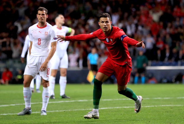 Portugal's Cristiano Ronaldo, right, celebrates scoring against Switzerland in the Nations League semi-final