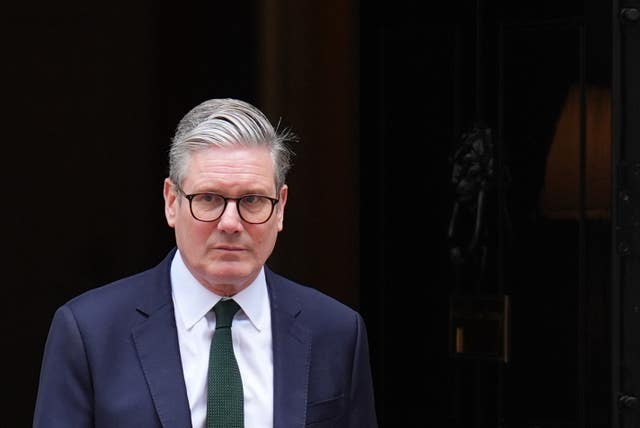 Head and shoulders shot of Sir Keir Starmer against a dark background