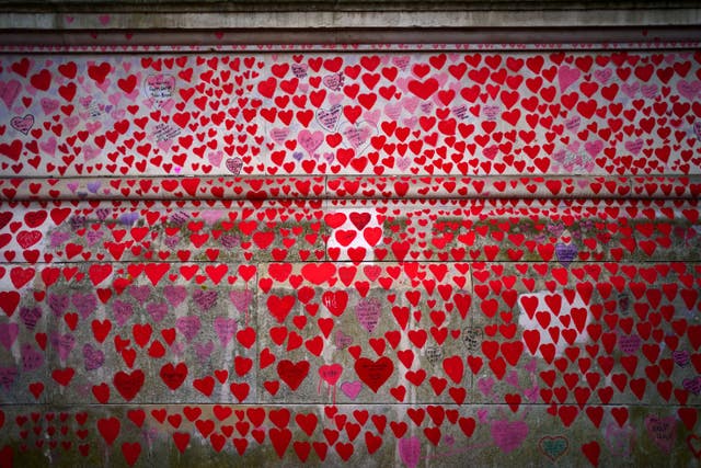 The National Covid Memorial Wall opposite the Palace of Westminster in central London, which bears hearts drawn by the relatives of people who have died of the virus