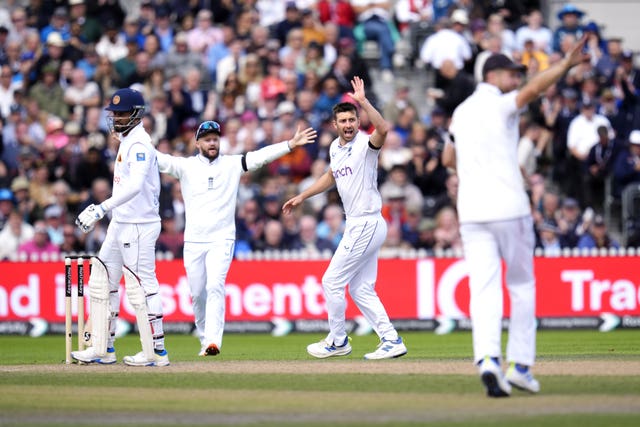 England’s Mark Wood (centre) successfully appeals for the wicket of Sri Lanka’s Dimuth Karunaratne