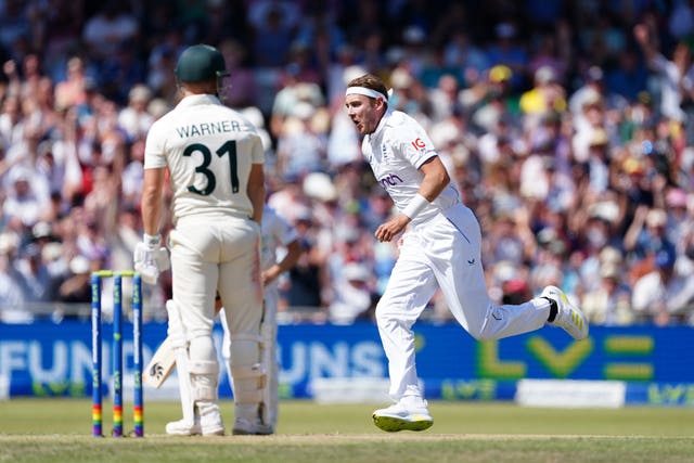 Stuart Broad, right, celebrates after taking the wicket of Australia’s David Warner in the second innings at Headingley