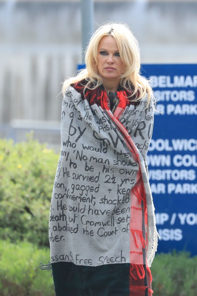 Actress Pamela Anderson wrapped in blanket