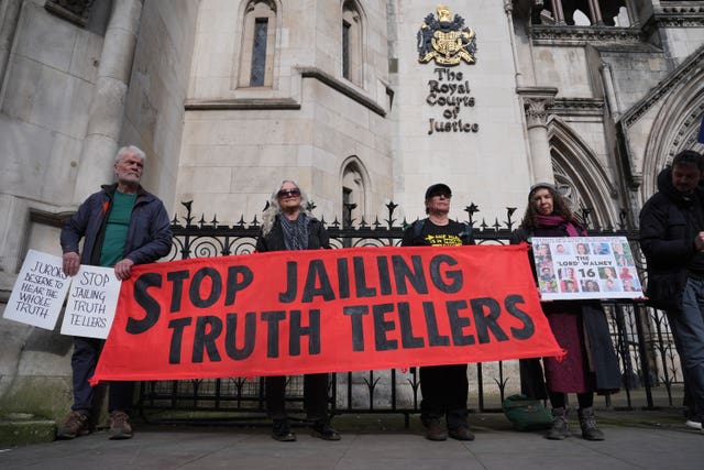 Just Stop Oil campaigners outside the Court of Appeal with a banner that reads 'stop jailing truth tellers'