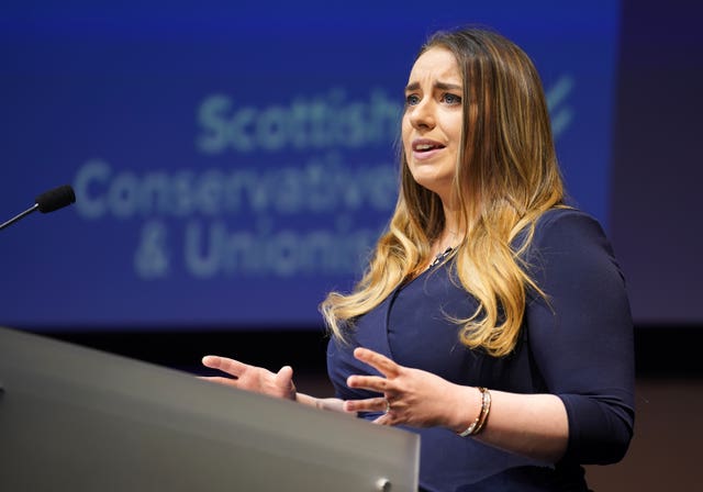 Meghan Gallacher delivering a speech from a lectern