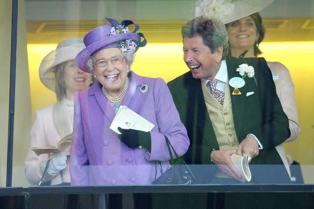 Queen Elizabeth II with her racing manager John Warren 