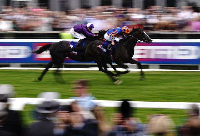 Auguste Rodin (right) on his way to winning the Derby