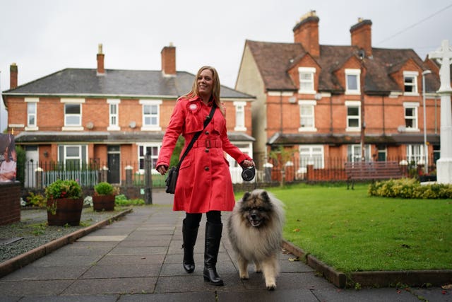 Labour candidate Sarah Edwards arrives with her dog Poykee to cast her vote