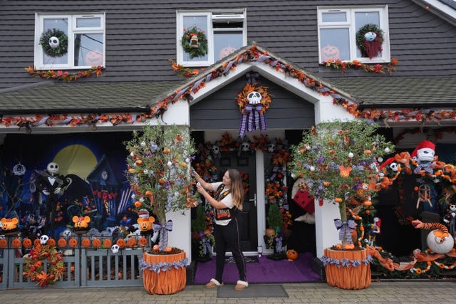 Lavinia Hedges putting the finishing touches to a Nightmare Before Christmas themed display